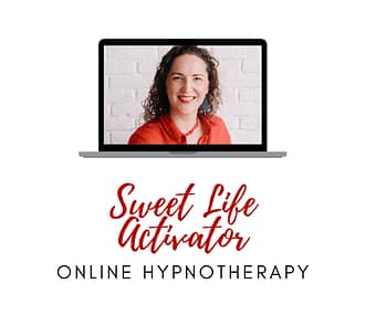 Curly haired lady smiling in a laptop